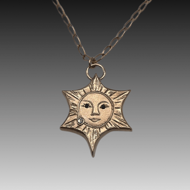 9ct yellow gold Sun with Black & White Diamonds